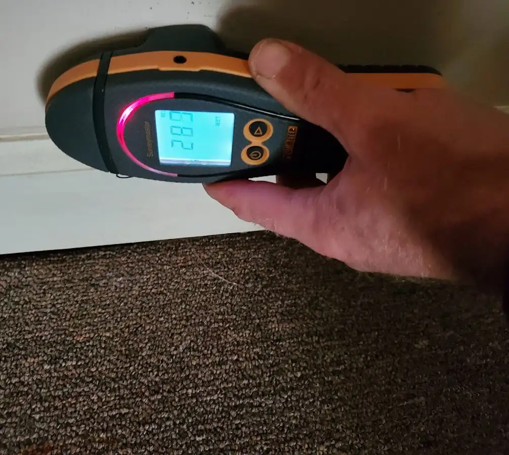 Moisture detection at baseboard during Storm Damage Restoration in Escondido
